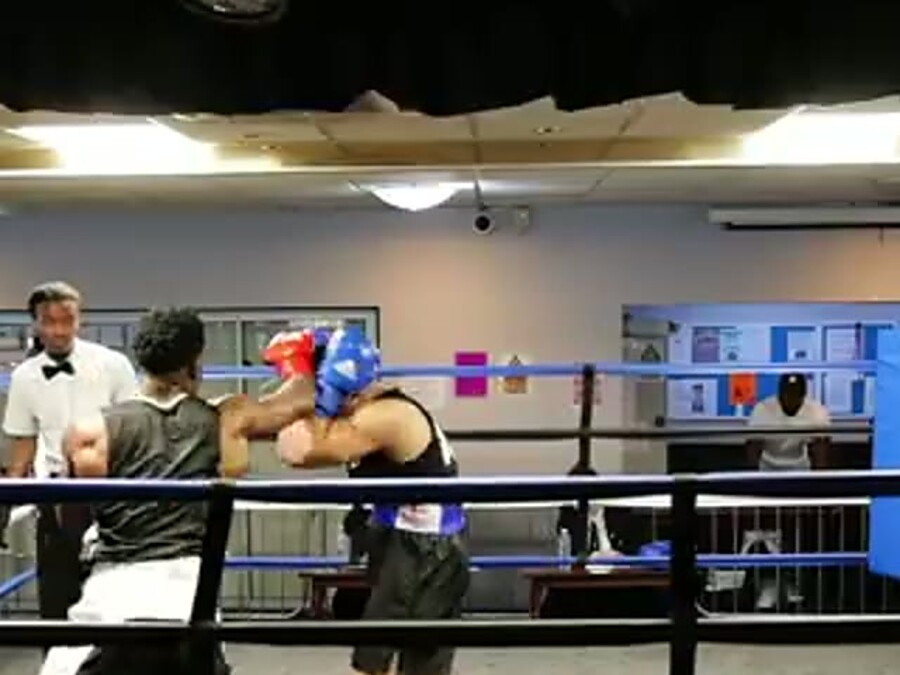 Boxers working in the ring during an amateur contest